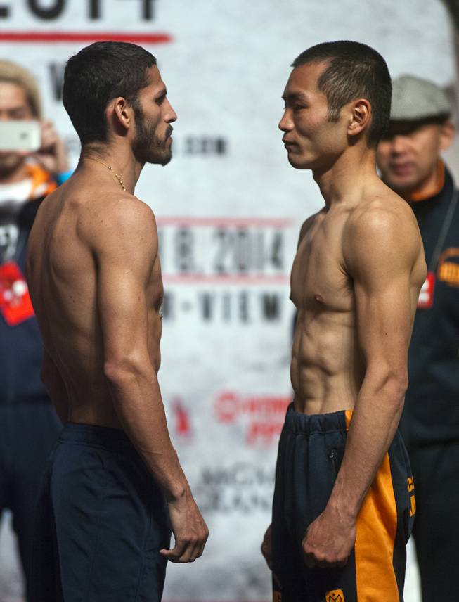 Lightweights Jorge Linares of Venezuela and Nihito Arakawa of Japan  face off following their weigh-ins at the MGM Grand Arena on Friday, March 07, 2014.